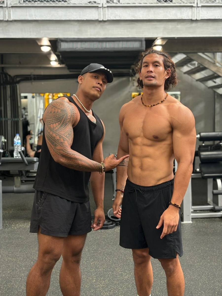 Coach Kanoon with a client in the gym